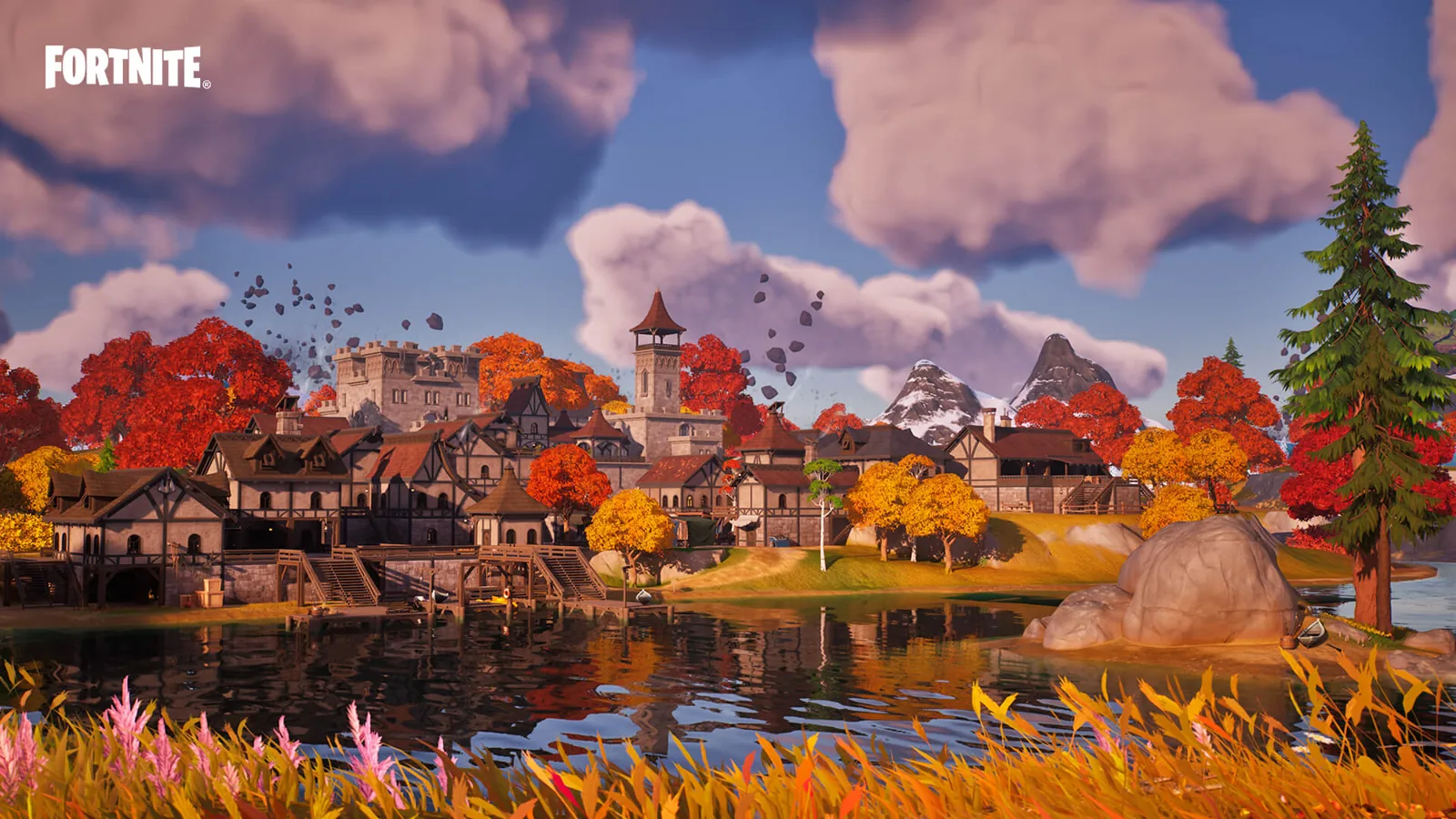 Panorama dell’isola di Fortnite con paese, alberi autunnali e acqua